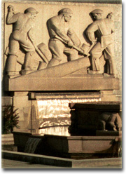 [ a fountain in Oslo, Norway, showing three workers ]